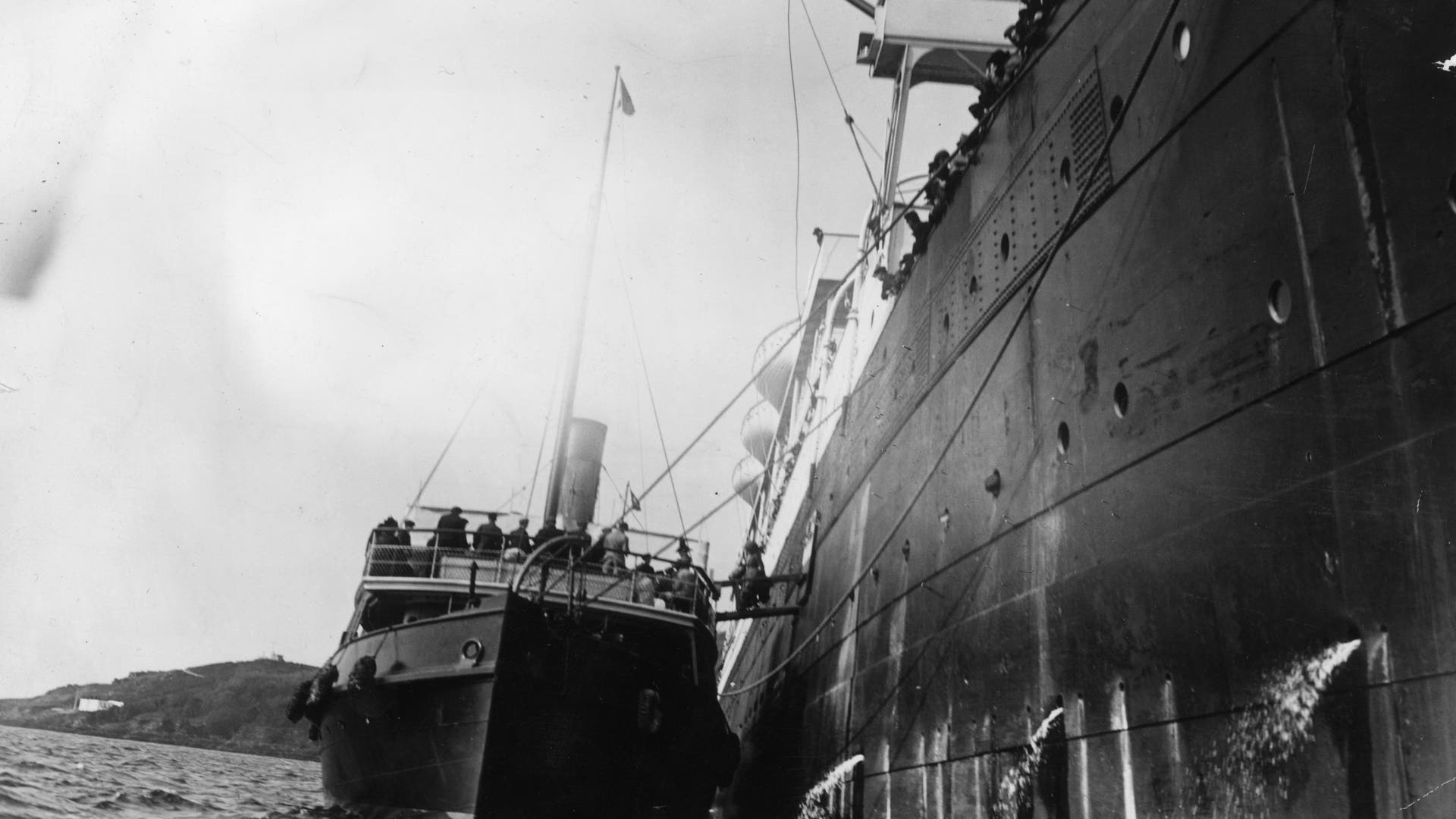 April 1912: Survivors of the Titanic disaster boarding a tug from the liner which rescued them. (Photo by Hulton Archive/Getty Images)