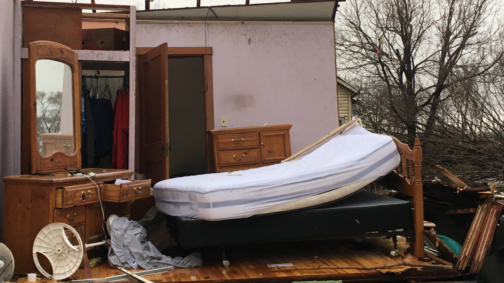 Tornadoes touched down in the upper Midwest and northern Arkansas, killing at least three people.