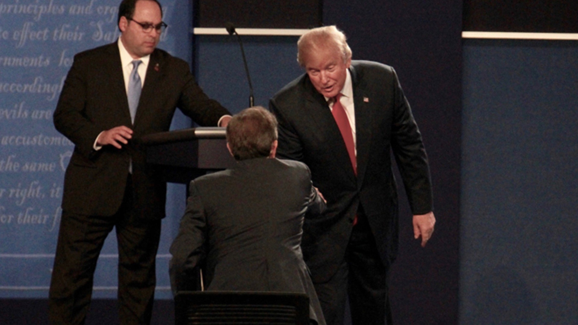 Republican presidential candidate Donald Trump shakes hands with moderator Chris Wallace at the final debate