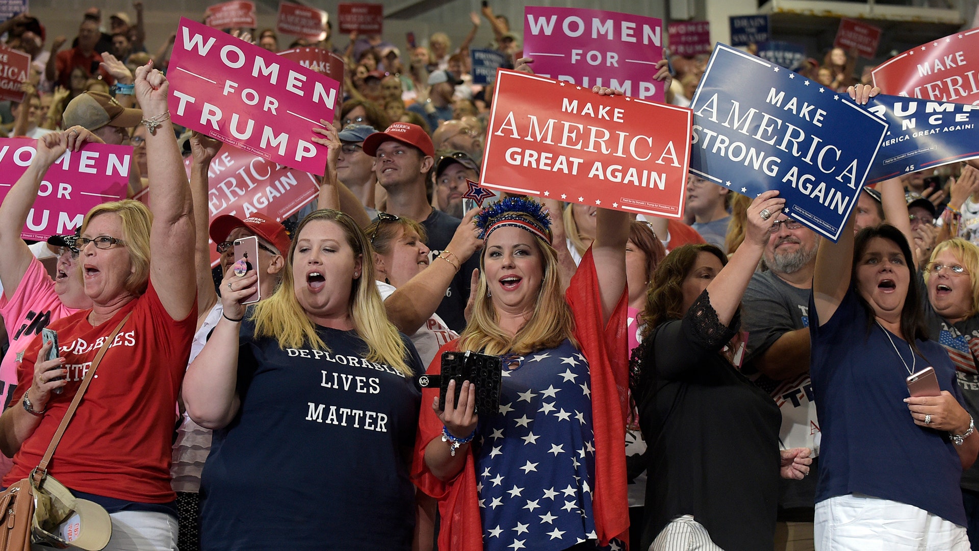 People cheer for President Donald Trump at a campaign-style rally at Big Sandy Superstore Arena in Huntington, W.Va., Aug. 3.