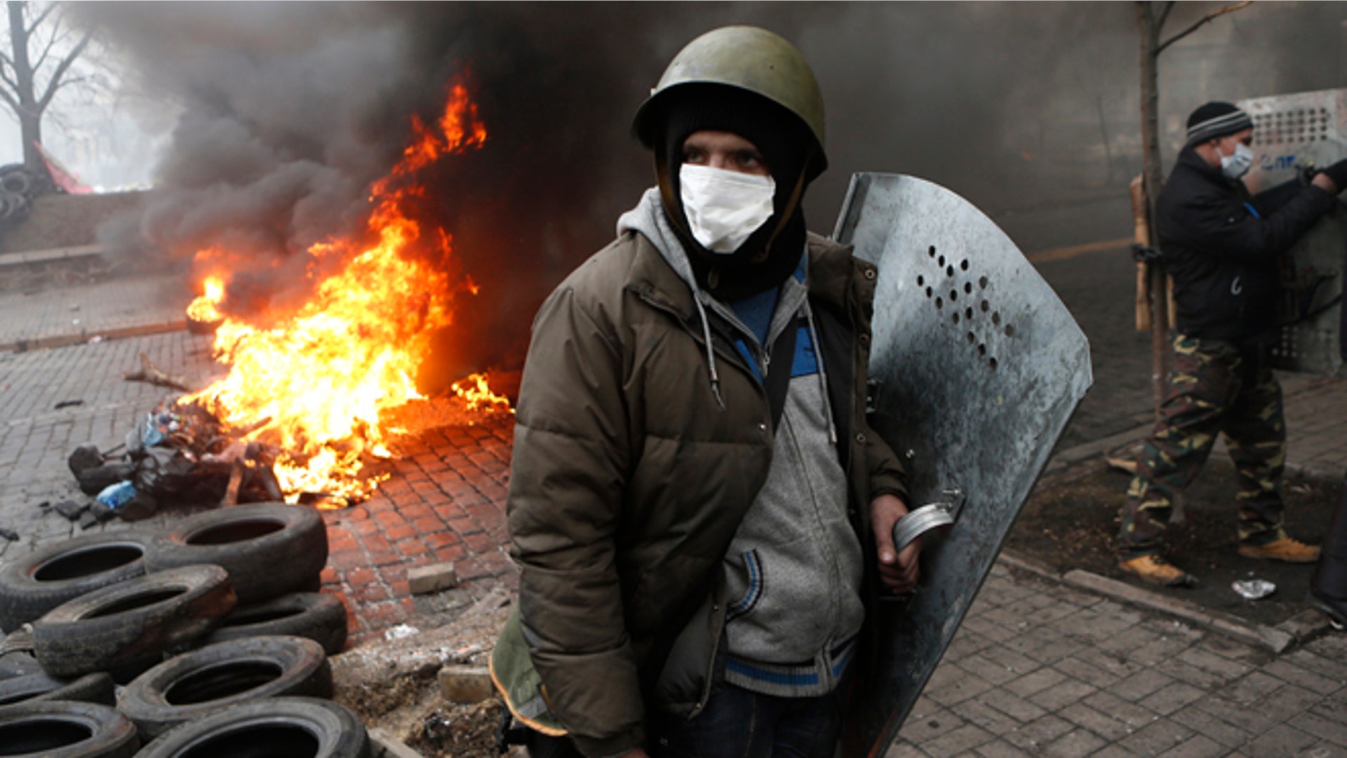 Protesters man a barricade