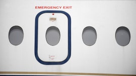 Passengers restrain woman who allegedly tried to open exit door during flight