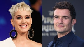 Orlando Bloom jokes Katy Perry is 'thirsty' as she poses with shirtless Justin Bieber poster