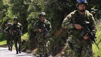 Colombia's FARC concealing weapons despite deal, intelligence analysts say