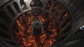 Holy fire ceremony in Jerusalem draws thousands