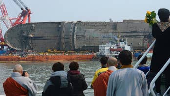 South Korea holds memorial for 9 missing ferry victims
