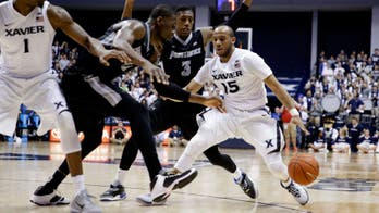 Myles Davis' triple-double leads No. 8 Xavier over No. 23 Providence