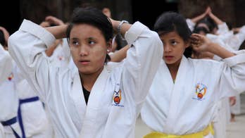 Uprooted by war, fearing troops, Myanmar girls learn karate