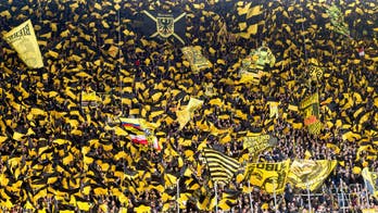 Borussia Dortmund's supporters go silent after fan dies during match