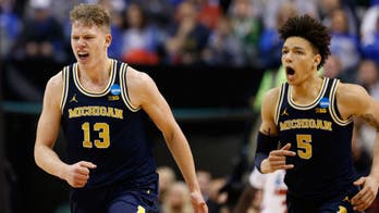 Michigan upsets No. 2 seed Louisville, continues amazing run of invincibility