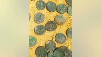Workers unearth large trove of Roman coins at Spanish park