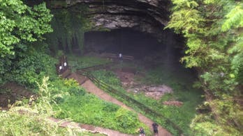 Trapped group escapes Kentucky cave through neck-deep water