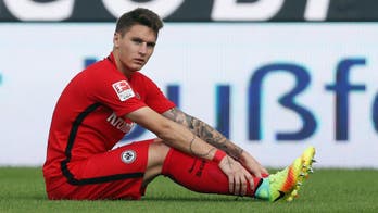 Frankfurt player suspended after getting tattoo, says he's 'been nailed to the cross'