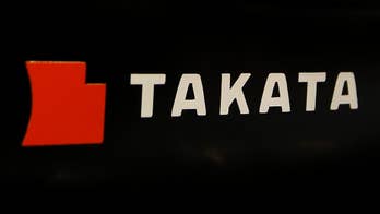 Takata still plans return to black for year as profit slips