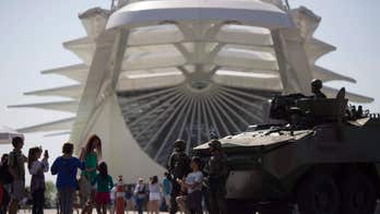 Armored cars, soldiers in camouflage secure Rio Olympics