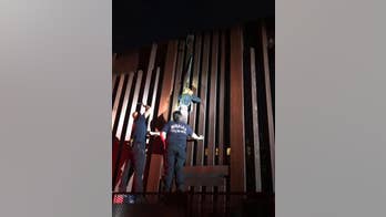 Smugglers abandon Mexican woman found dangling from border fence