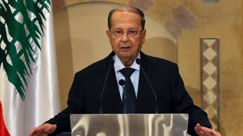 Lebanese president in Egypt, defends Hezbollah's arms