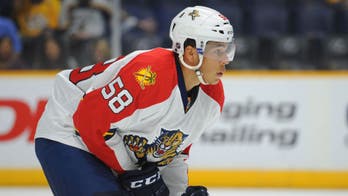 Defenseman Jonathan Racine re-signs with the Florida Panthers