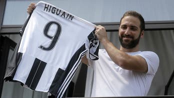 Napoli fans are still pissed, putting Higuain jerseys on trash cans