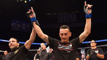 Max Holloway wins after Charles Oliveira injures shoulder in main event