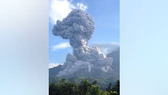 Guatemala's Santiaguito volcano spouts ash plume