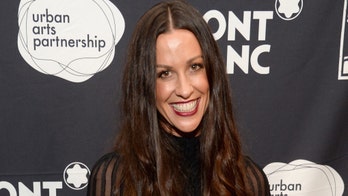 Alanis Morissette posts photo of her newborn son breastfeeding, says it's 'not always easy peasy'