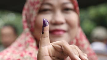 Polls open in divisive vote for Indonesia capital governor