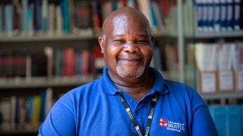 'Jolly' janitor weeps upon receiving $2,000 vacation from students