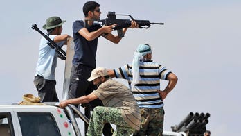 Libyan Fighters Seal Off Qaddafi's Hometown