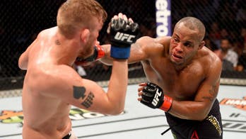 Daniel Cormier defends title in five-round bloody war over Alexander Gustafsson