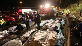 Tour bus flips over on Taiwan highway, killing 17 people