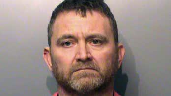 Man accused of killing 2 officers had praised police earlier