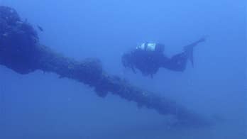 WWII soldiers dumped into mass grave after shipwrecks scavenged, report says