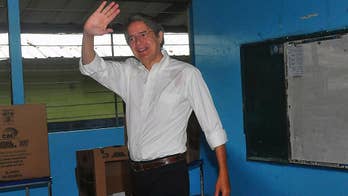 The Latest: Ecuadoreans choosing president in close race