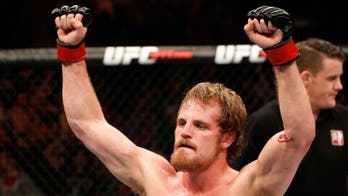 Gunnar Nelson wobbles Alan Jouban on the feet, chokes him out on the ground
