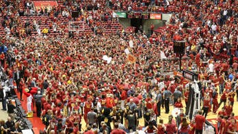Local columnist suffers broken leg in Iowa State court storming