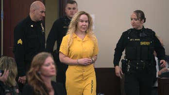 Woman arrested in death of twin in cliff crash due in court