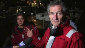 2 rescued from capsized yacht in heavy seas off Australia