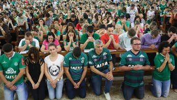 Thousands squeeze into church, stadium to mourn tragic crash
