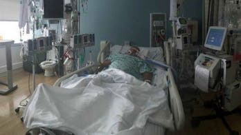 Man who contracted flesh-eating bacteria while crabbing has legs amputated, daughter says