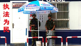 Restive Chinese region offers rewards to recruit more police