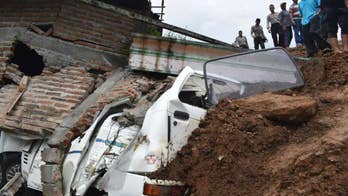 Landslide buries over 2 dozen people in central Indonesia
