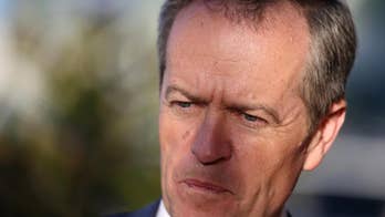 After days of limbo, Australian premier claims election win