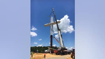 Massive cross with crown of thorns towers over Mississippi interstate