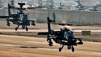 Guard Reluctantly Begins Plan to Give Up Apaches