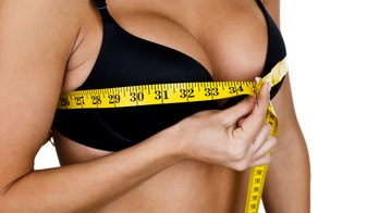 Playboy model Lindsey Pelas says her 30HH breasts cause pain, back problems