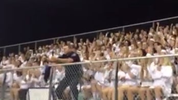 High school security officer's football game cheer goes viral