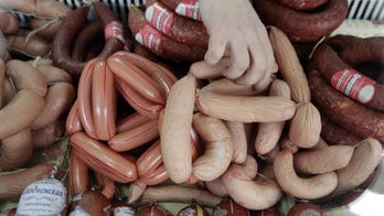 UK bacon and sausages sales hit by cancer link - report