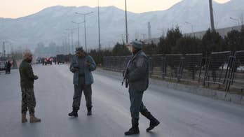 The Latest: Afghan official says twin bombings wound 50