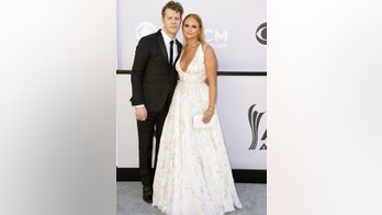 Miranda Lambert looks bridal in low-cut white gown at ACM Awards